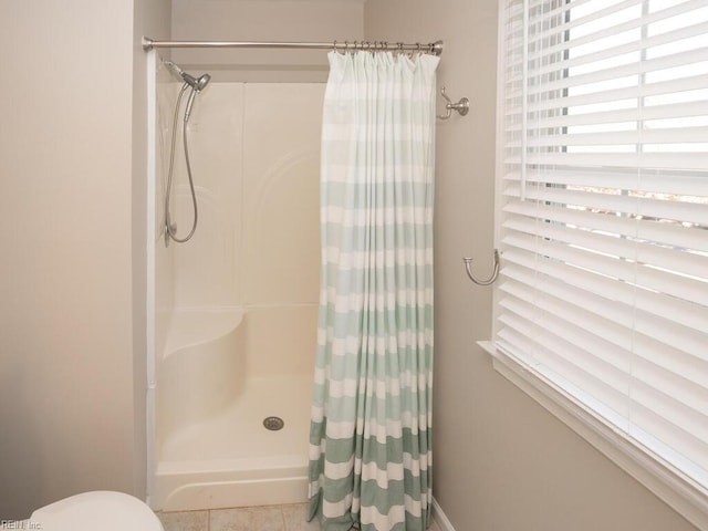 bathroom featuring tile patterned floors and a shower with shower curtain