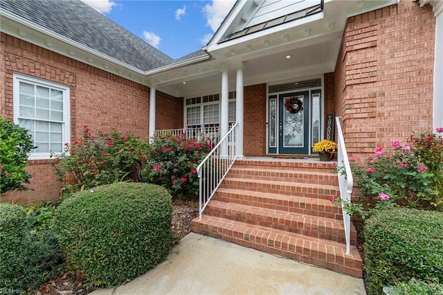 property entrance featuring covered porch