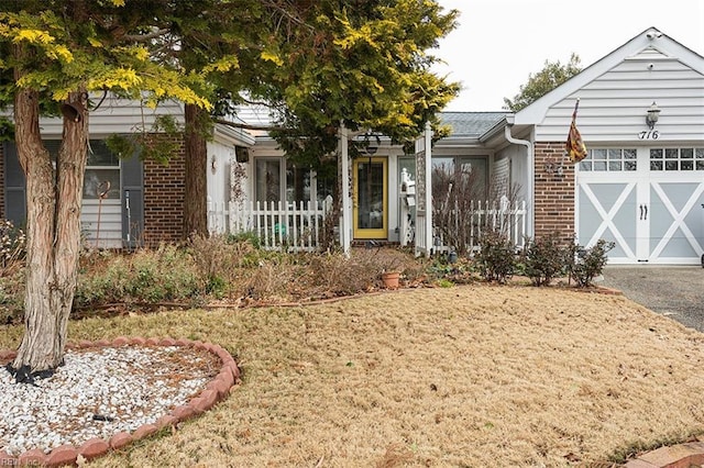 view of front facade with a front lawn and a garage