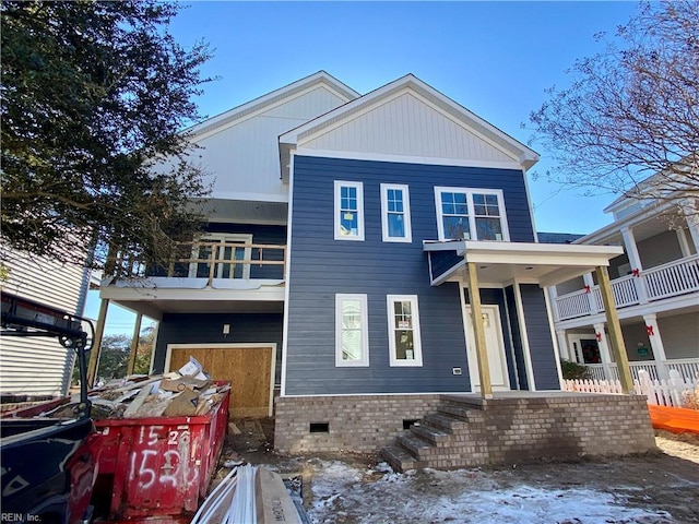 view of front of house with crawl space and a balcony