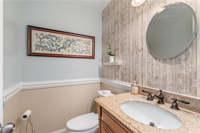 bathroom with toilet and vanity