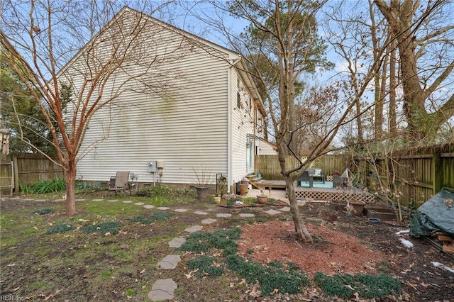 view of side of home featuring a deck