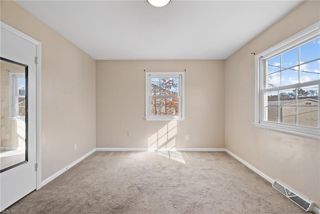 empty room featuring light carpet