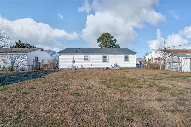 back of house with a yard