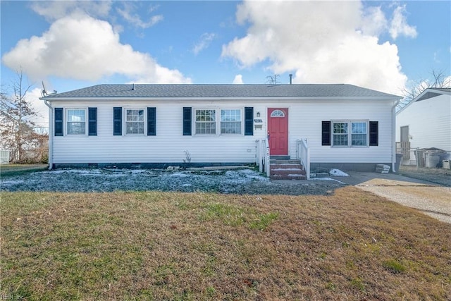 ranch-style home with a front lawn