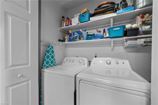 clothes washing area featuring washer and dryer