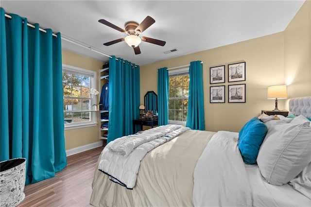 bedroom featuring ceiling fan and hardwood / wood-style floors