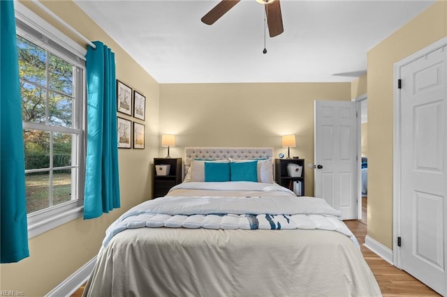 bedroom featuring light wood-type flooring and ceiling fan