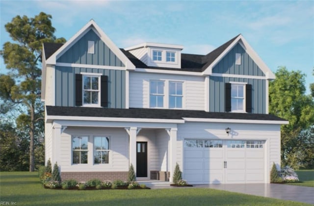 view of front of house featuring a garage and a front lawn