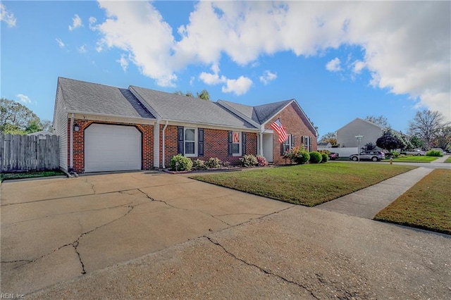 ranch-style home featuring a front lawn and a garage