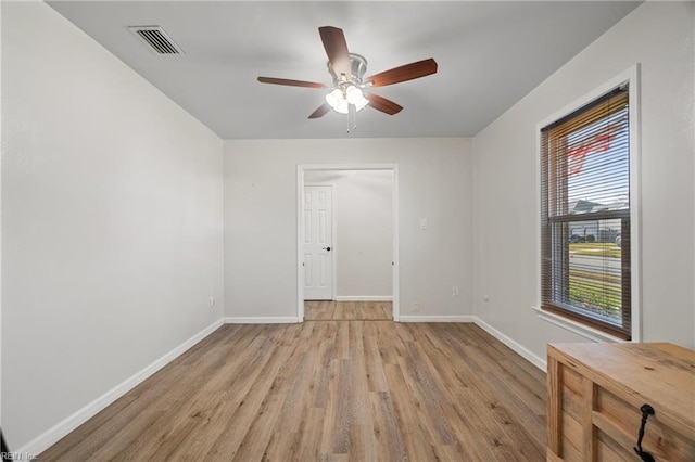 spare room featuring ceiling fan and light hardwood / wood-style floors