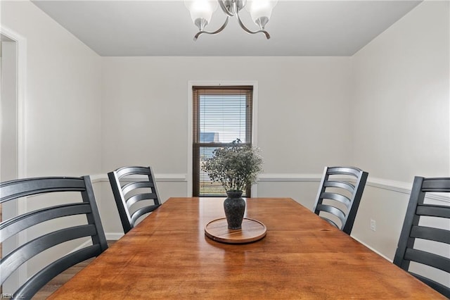 dining room featuring a notable chandelier