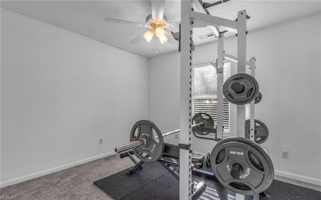 workout room featuring carpet and ceiling fan