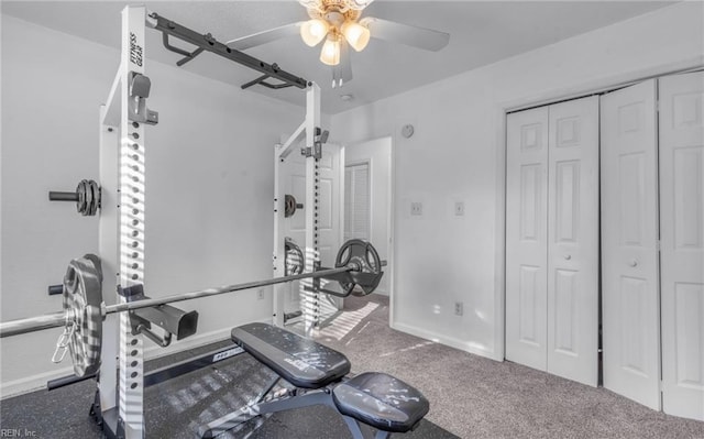 workout area featuring carpet flooring and ceiling fan