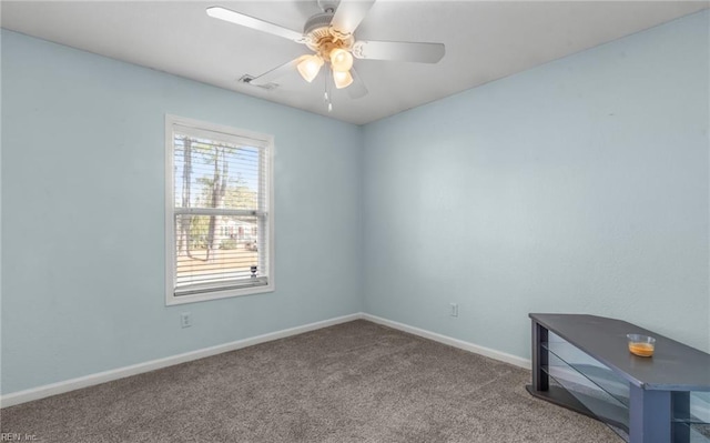 empty room featuring ceiling fan and carpet floors