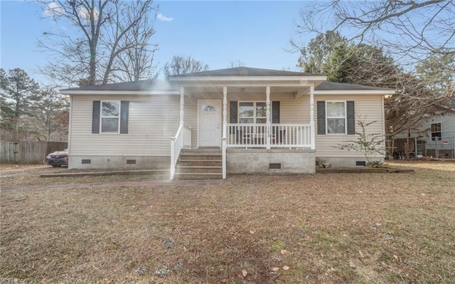 view of front facade with covered porch and a front lawn