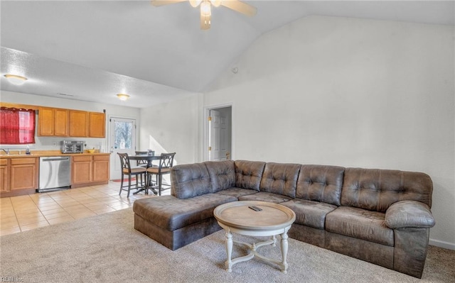 tiled living room featuring ceiling fan and vaulted ceiling