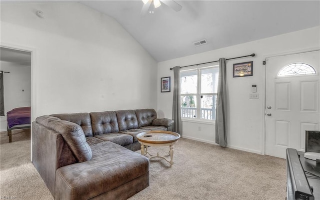 carpeted living room featuring ceiling fan and vaulted ceiling