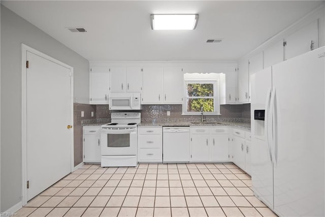 kitchen featuring white appliances, backsplash, sink, white cabinetry, and light tile patterned flooring