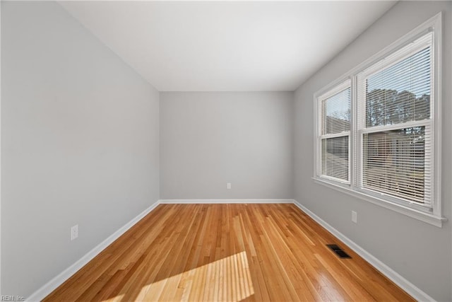 spare room with light hardwood / wood-style floors