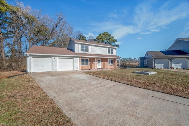 view of property featuring a front lawn and a garage