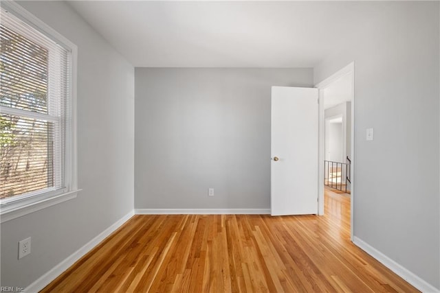 spare room with light hardwood / wood-style flooring