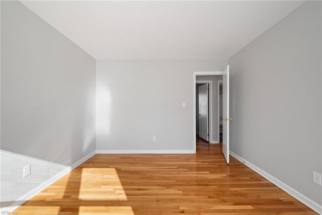 spare room featuring hardwood / wood-style floors