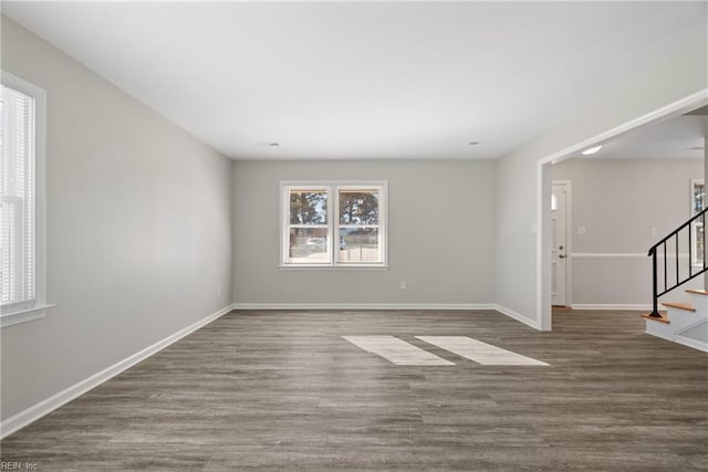 empty room featuring wood-type flooring