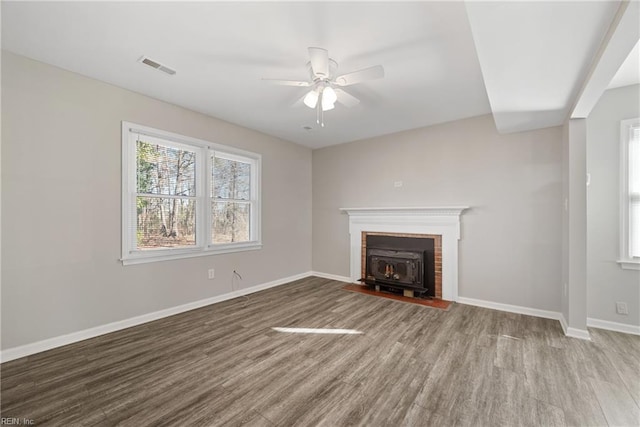 unfurnished living room with ceiling fan and hardwood / wood-style flooring