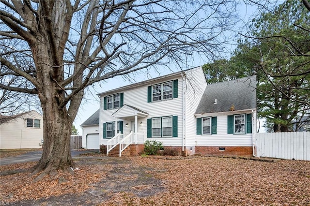 colonial inspired home featuring a garage