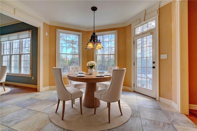 dining space featuring crown molding, light tile patterned floors, and a notable chandelier