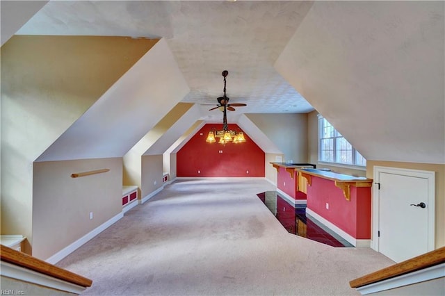 bonus room with lofted ceiling, carpet floors, and ceiling fan