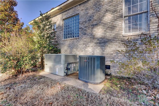 view of side of home featuring central air condition unit