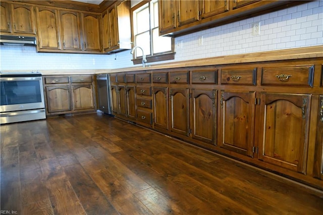 kitchen featuring backsplash, electric range, dark hardwood / wood-style flooring, and sink