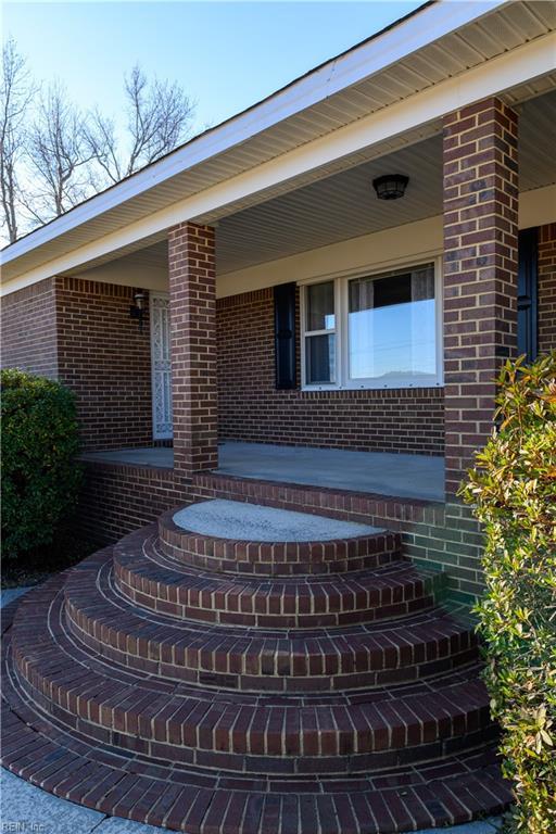 entrance to property with a porch