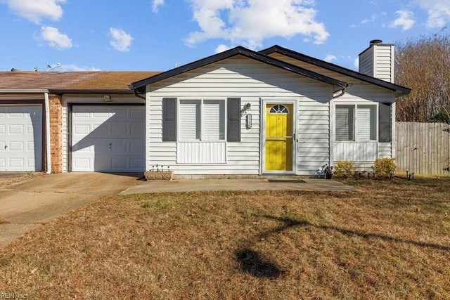 single story home featuring a garage and a front yard