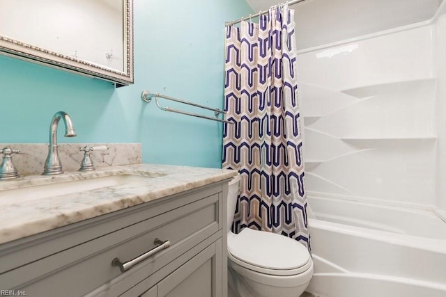 full bathroom with vanity, toilet, and shower / bath combo with shower curtain