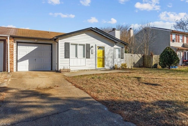 ranch-style house with a garage and a front lawn