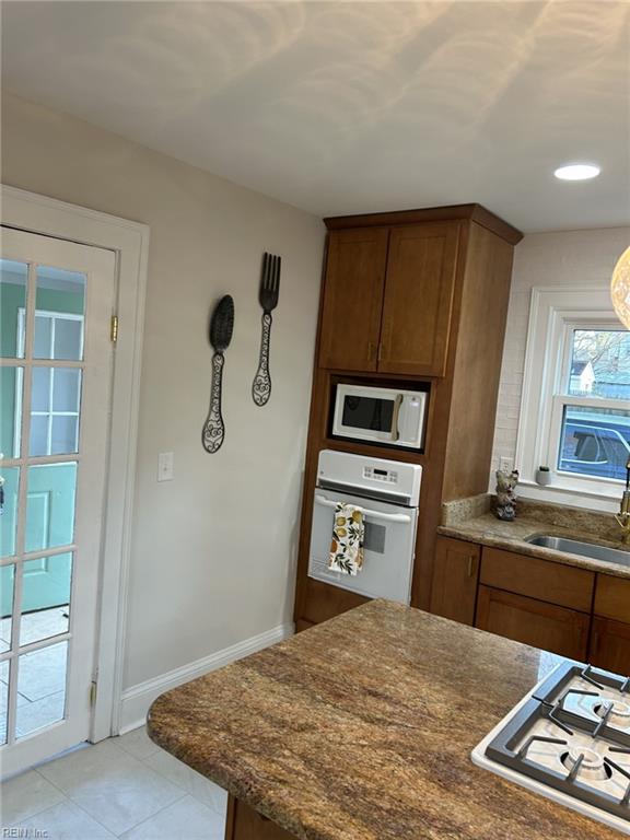 kitchen with sink and white appliances