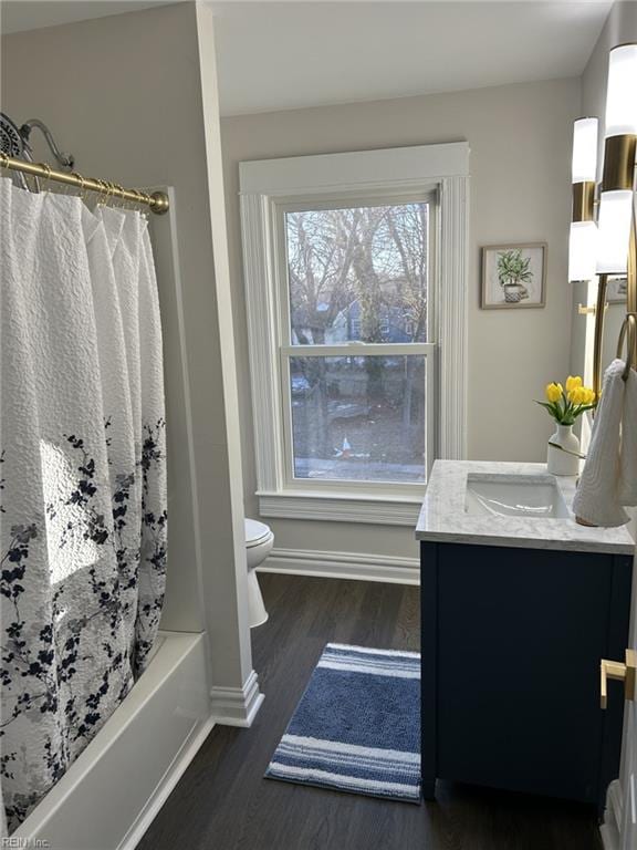 full bathroom with vanity, toilet, shower / bath combo, and wood-type flooring