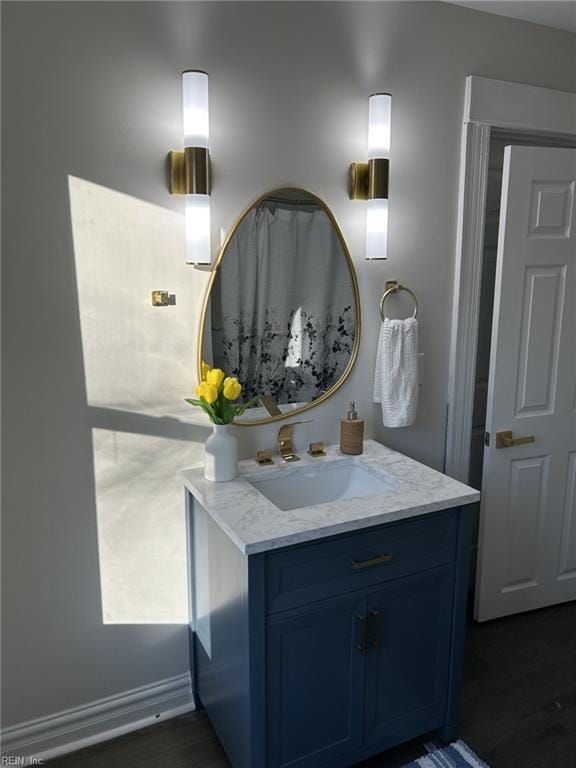 bathroom featuring hardwood / wood-style flooring and vanity