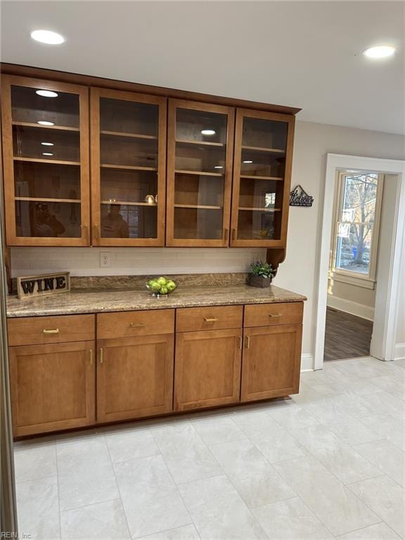 bar featuring stone countertops