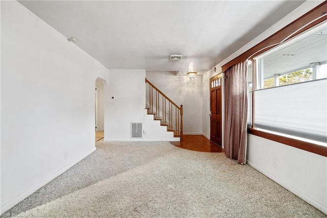 interior space featuring light colored carpet