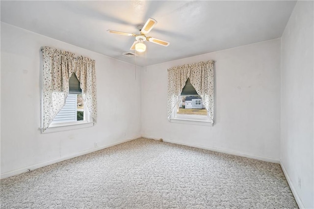 empty room with carpet flooring and ceiling fan