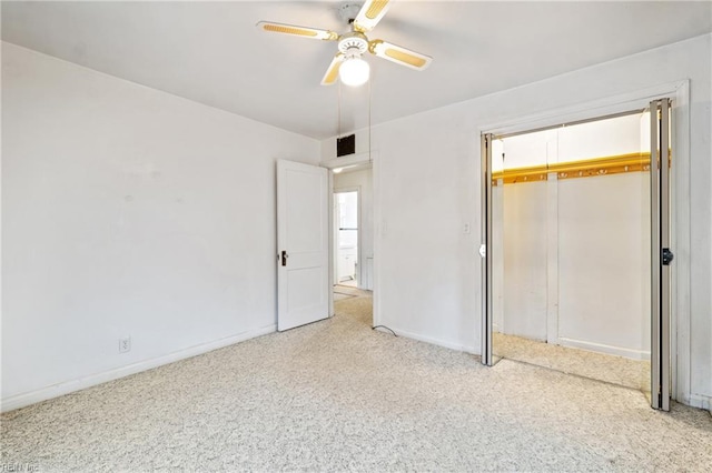 unfurnished bedroom featuring light carpet, a closet, and ceiling fan