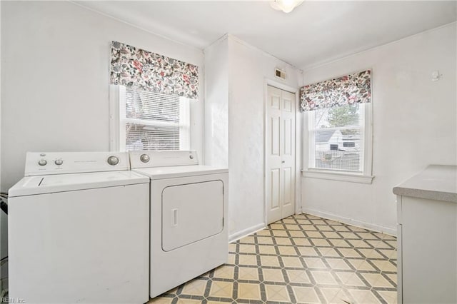 laundry area with separate washer and dryer