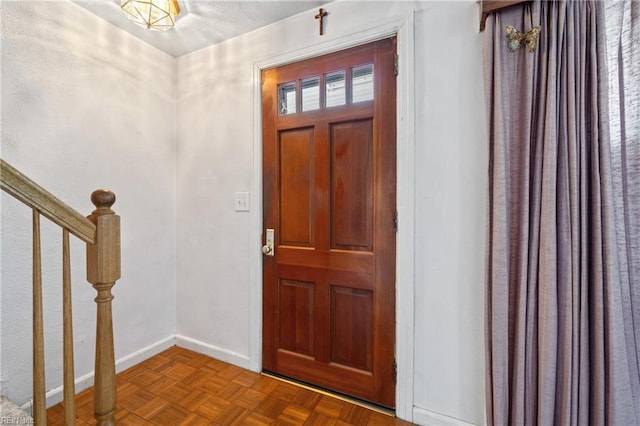 entryway with parquet floors