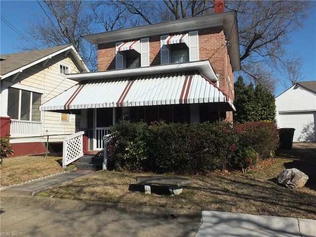 view of front of property featuring an outbuilding and a garage