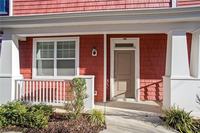 doorway to property with covered porch