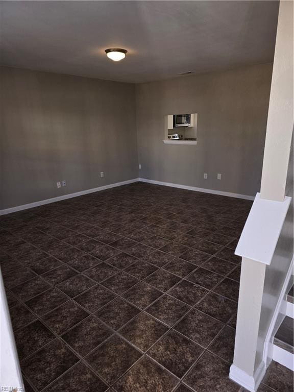 empty room with baseboards